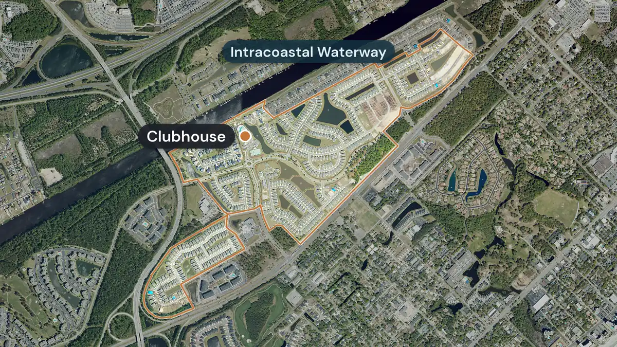 Del Webb at Grande Dunes from above, with its edge drawn in orange beside the Intracoastal Waterway, streets of homes around ponds, and the clubhouse marked